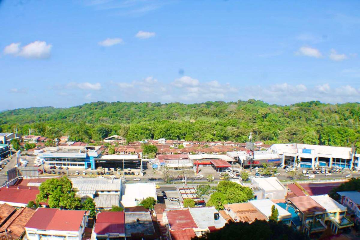 Drone view of Panama City commercial residential and forest edge Villa de las Fuentes
