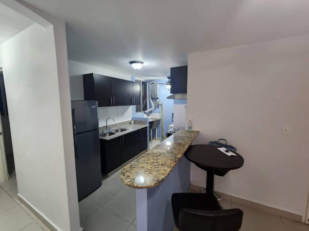 Kitchen with granite bar and tiled backsplash Torres de Toscana Panama