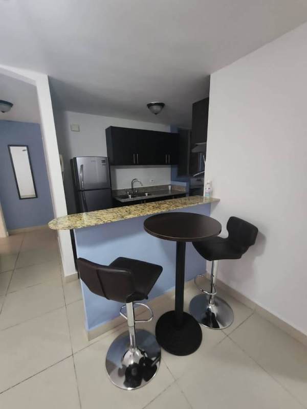 Spacious living room with tiled floor and access to balcony PH Torres de Toscana Ancón Panama