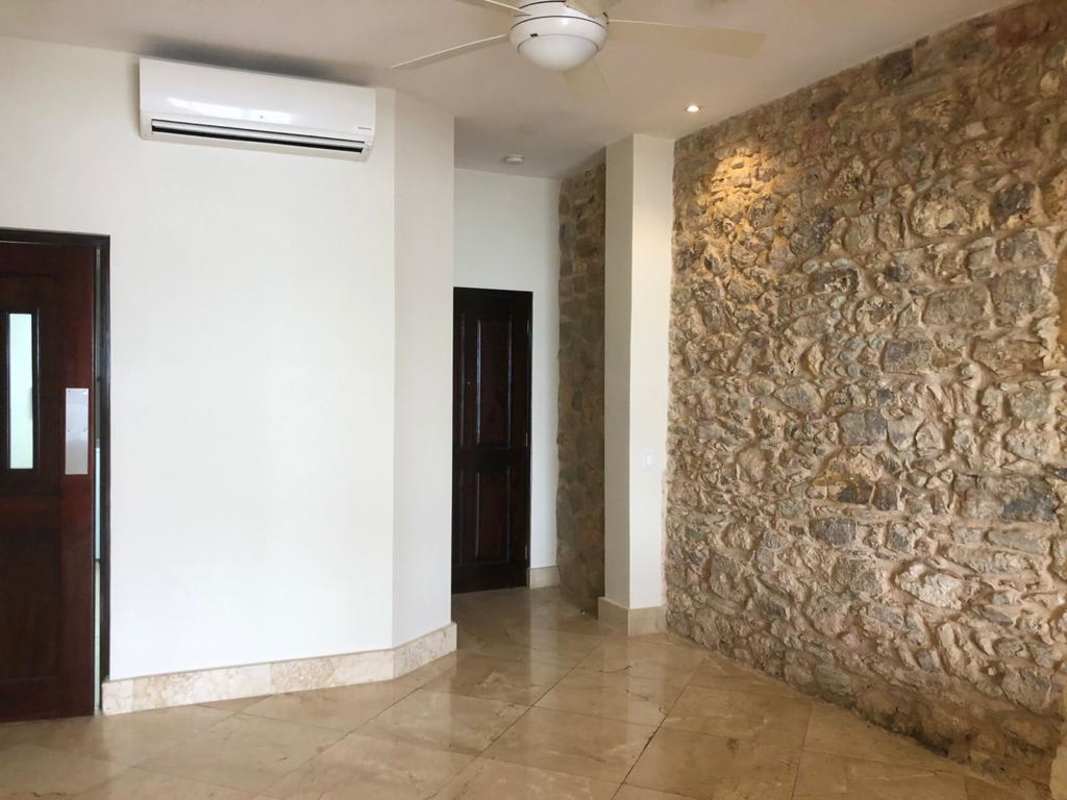 Spacious living area with marble floors and balcony ocean view Casco Viejo Panama