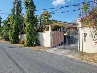 Front exterior view Mediterranean style with covered driveway, cobblestone pavement in Golf Club Coronado Panama