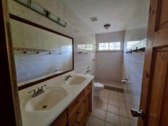 Spacious bathroom with double vanity, large mirror and ceramic tile Coronado Golf Mansion Panama