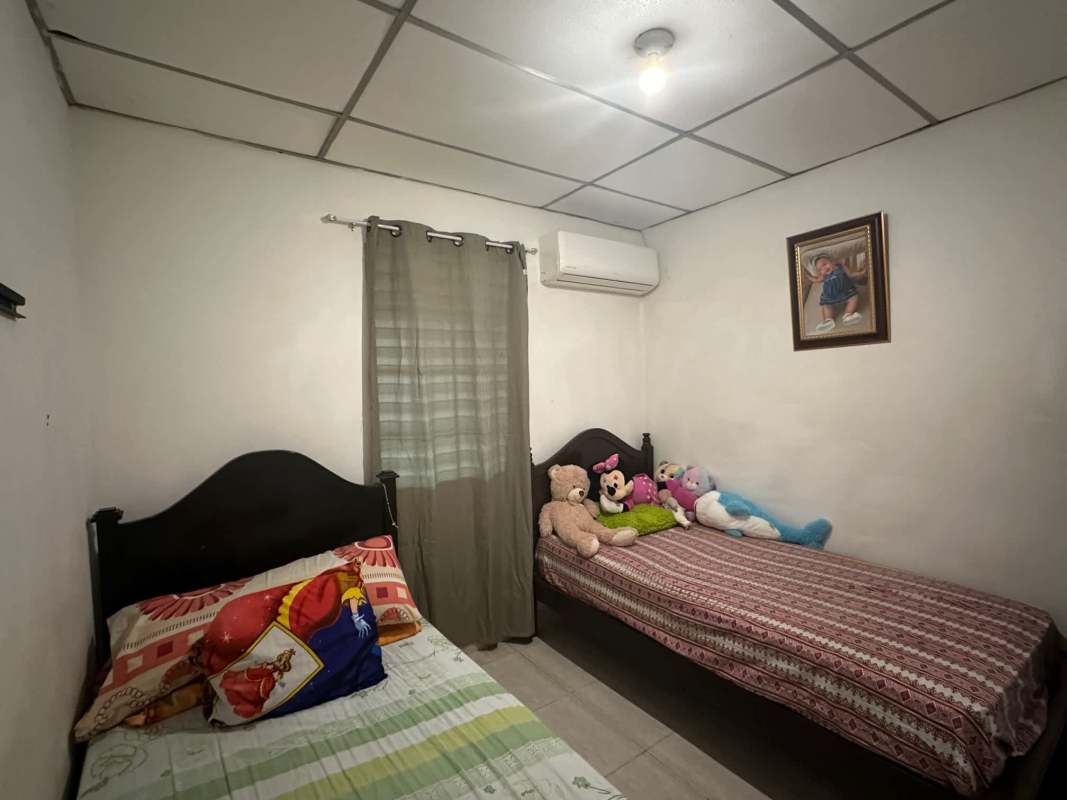 Functional kitchen with tile backsplash, double sink, gas stove in house in Don Bosco Panama