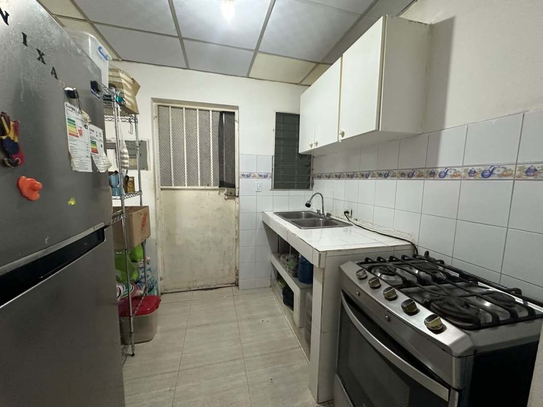 Bright living and dining area with tiled floors in 2-bedroom house Villas de Las Acacias Don Bosco