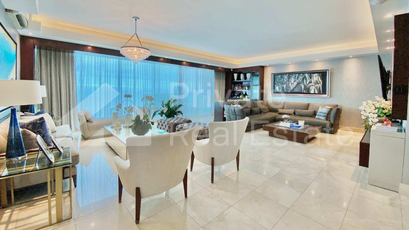 Luxury living room with city and ocean views, modern furnishings, marble floors at PH Ocean Two Panama