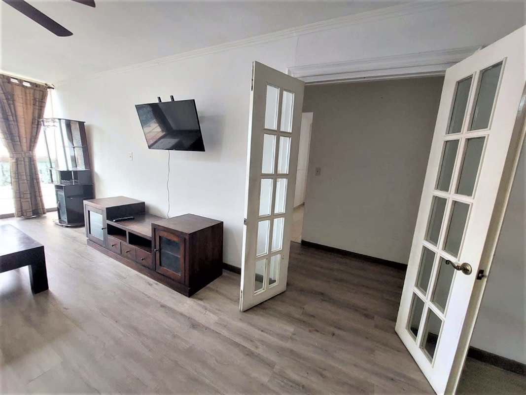 Contemporary bathroom with pedestal sink, glass shower enclosure, tile accents in PH El Cangrejo