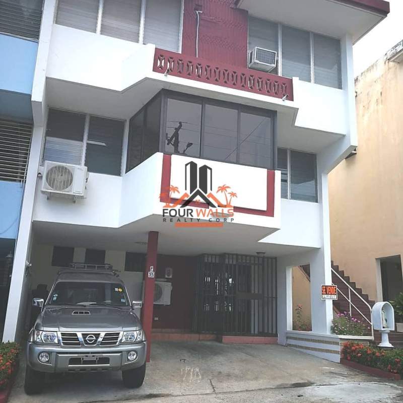 Multistory house with balcony, parking, exterior staircase and for sale sign Villa de las Fuentes Panama City