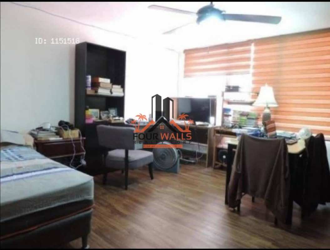 Bedroom with wooden floor, large window blinds, desk and bookshelves in Betania Panama property