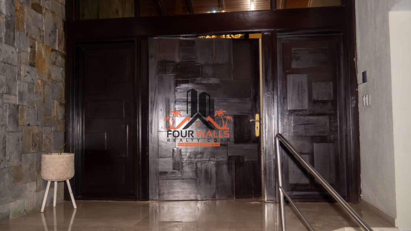 Spacious backyard with artificial turf, outdoor lighting in Dos Mares luxury mansion Panama