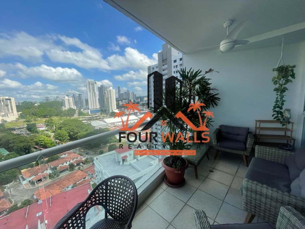 Spacious condo lobby area with seating, mirror wall and colorful artwork at PH Forum Panama