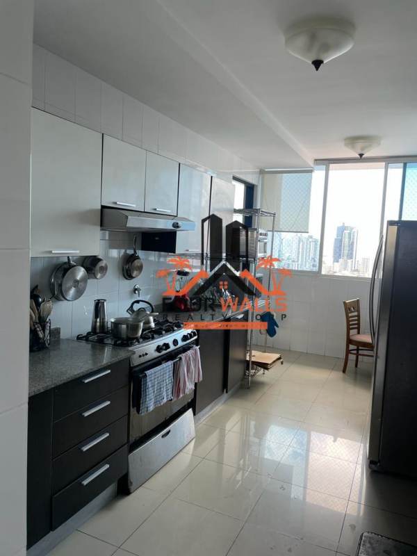 Kitchen with granite countertops, gas stove and stainless fridge at PH Forum Panama City