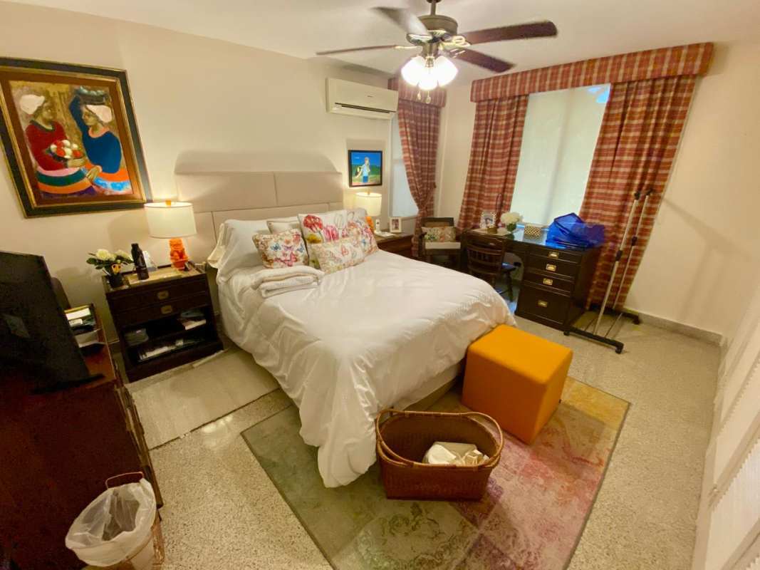 Bedroom with built-in closet granite floors in PH El Cenit Panama City
