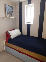 Furnished bedroom with closet and view of gardens in Bijao Beach Resort Quarry Heights Panama