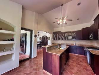 Open plan living and dining with vaulted ceilings in mountain villa Altos del María Panama