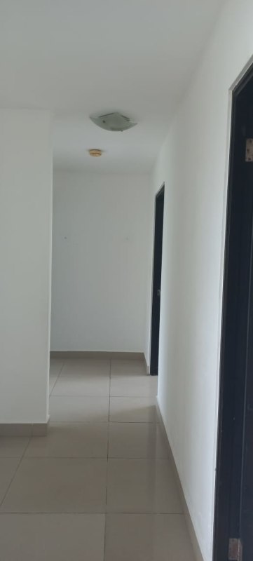 Spacious living area with natural light, balcony access and city green views in PH Pine Hill Albrook Panama