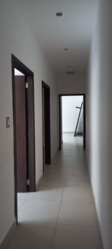 Covered patio with granite countertop BBQ and lush garden at Sunset Coast house in Costa Sur Panama