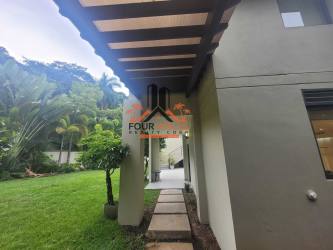 Contemporary open kitchen with large island in PH Nativa Panama Pacifico home