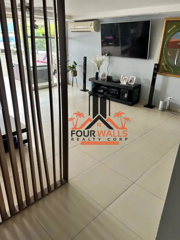 Apartment hallway with tile floor, wooden doors PH Diplomático Panama