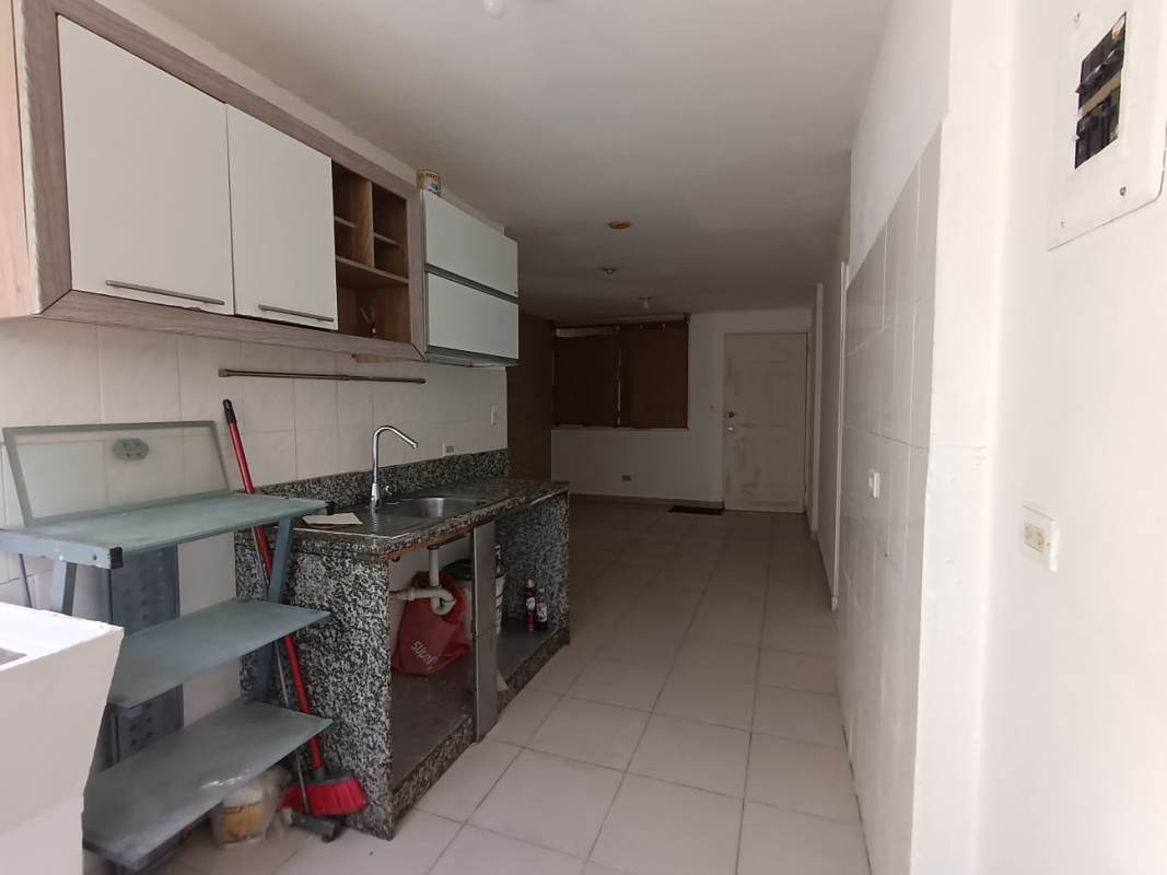 Modern minimalist kitchen with granite countertop cabinetry window light PH Mystic Park affordable apartment