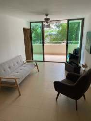 Open plan living room with sliding doors to balcony PH Ocean Front Gorgona Panama