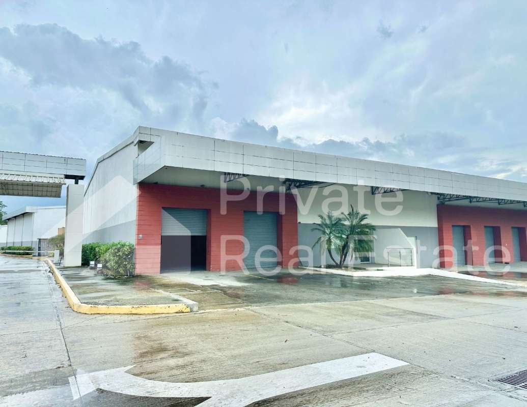 Exterior of warehouse facility with loading bays, canopy, and landscaped surroundings Tocumen