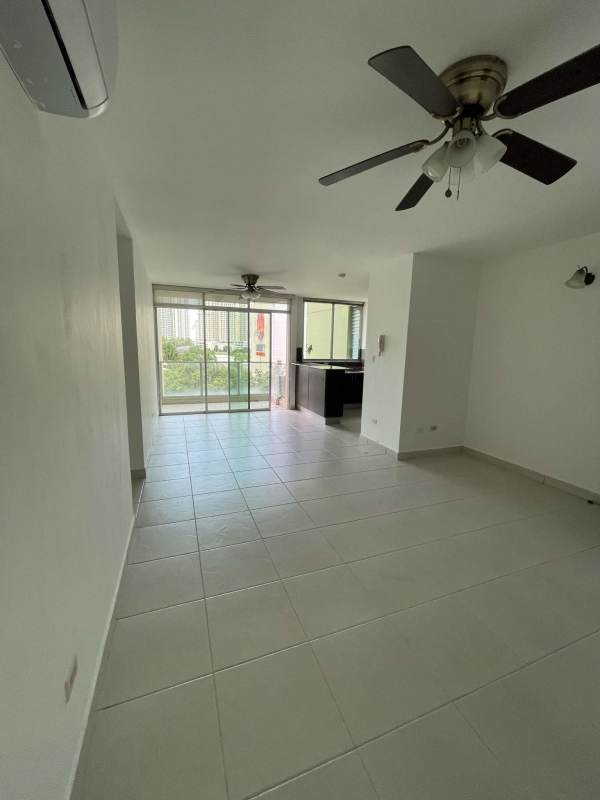 Open-plan living dining space with tile floors, balcony in Costa del Este apartment