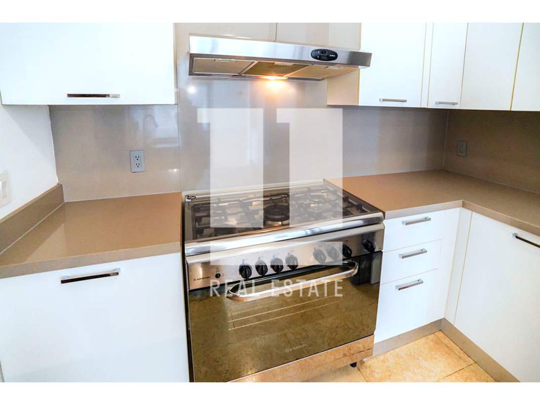 Spacious open living dining area with marble floors and golf view balcony in PH Greenview Santa Maria