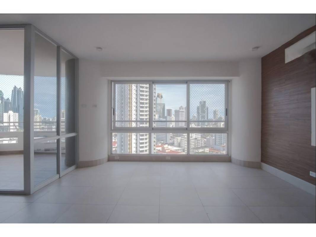 Living area large windows wood accent wall skyline view PH Luxor Tower Panama City