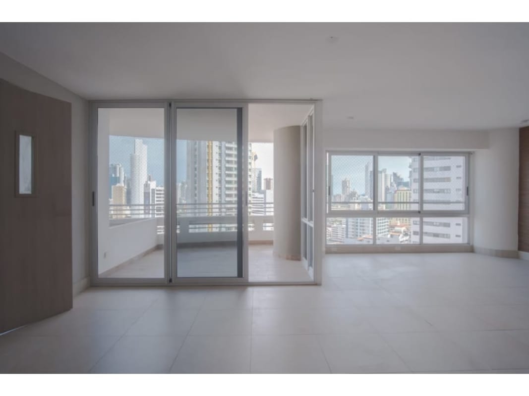 Empty bedroom with large window built-in wardrobe neutral tiles PH Luxor Tower Panama City Panama