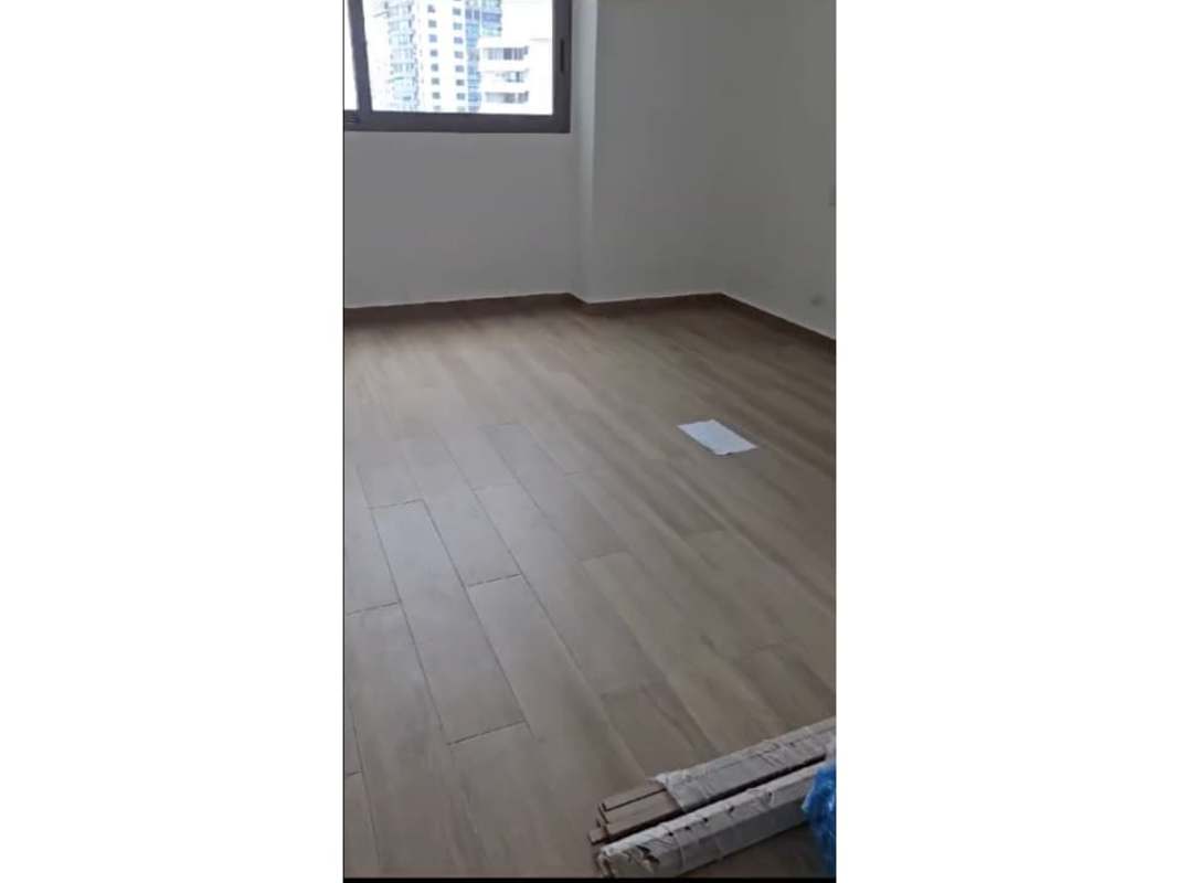 Spacious bedroom with sea view window wood style tile floor in Seapoint Panama
