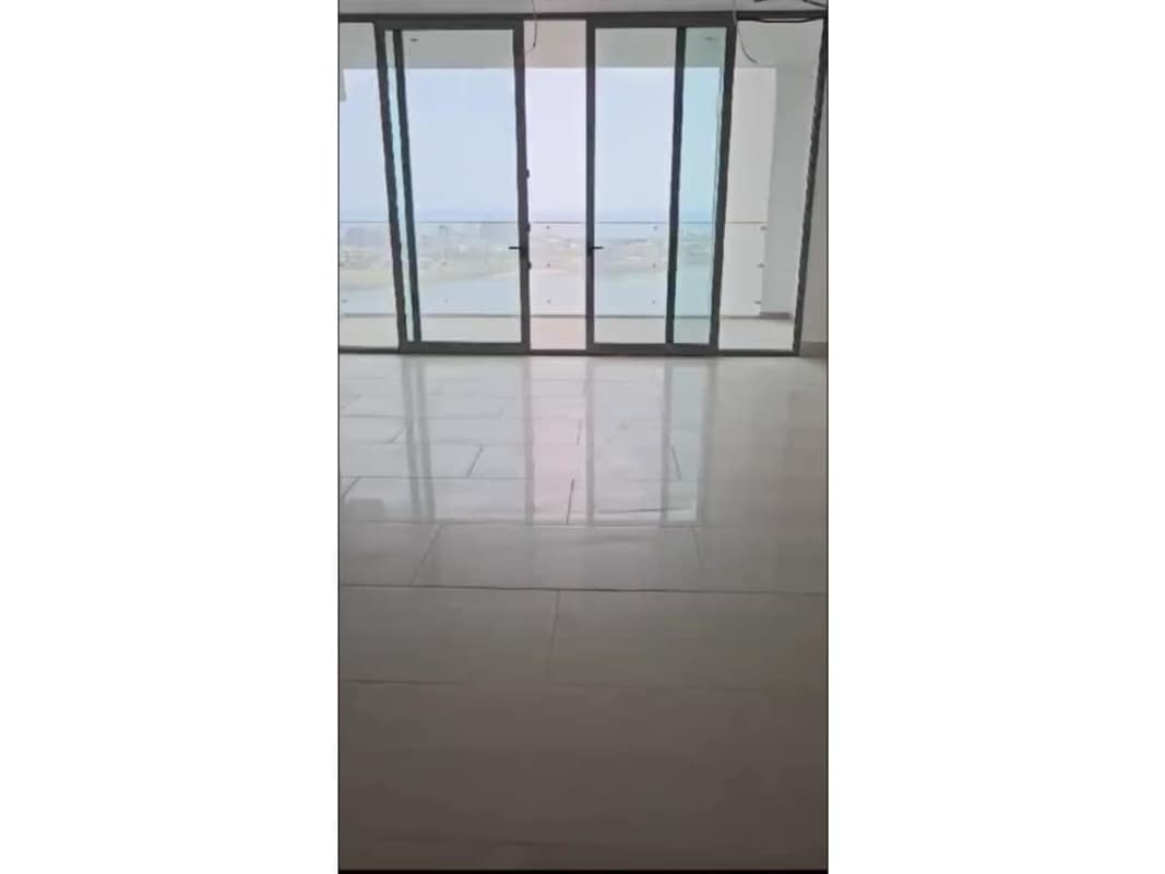 Large modern living room with panoramic windows and balcony Punta Paitilla Panama Seapoint