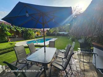 Rustic living dining with open vaulted wood ceiling Coronado house Panama
