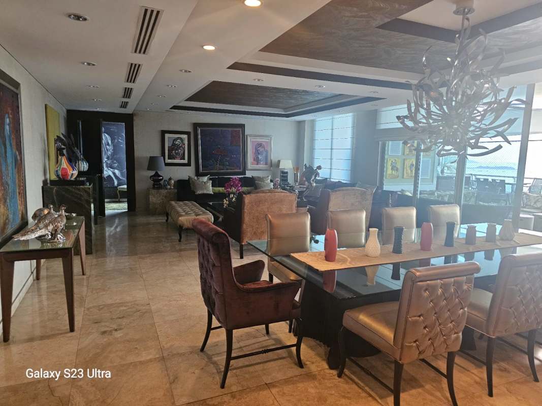 Luxury living dining area with marble floors, large art panels, contemporary decor, panoramic Pacific views PH Aqualina Panama