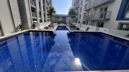 Modern guest bathroom with vanity, accent tiled wall and mirror PH Mosaic Panama