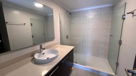 Resort-style swimming pool with sun loungers and gardens in PH Mosaic Panama