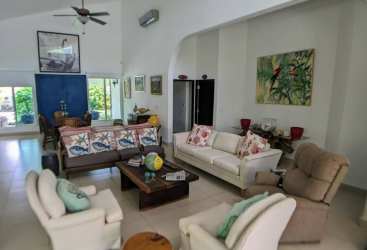 Large bright bedroom with king bed, tile floor, tropical accents Punta Barco Village Panama