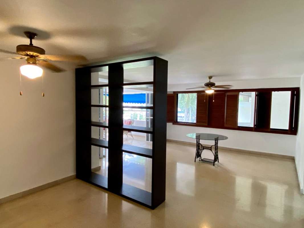 Large open living dining space with ceiling fans and large windows in PH Bella Vista Park Panama City