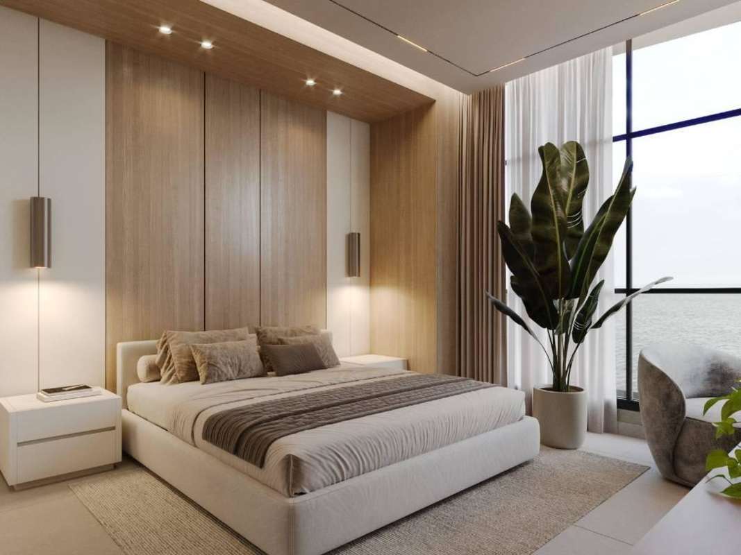 Minimalist bedroom with large windows overlooking ocean, wood accents at PH Torre Aqua Panama