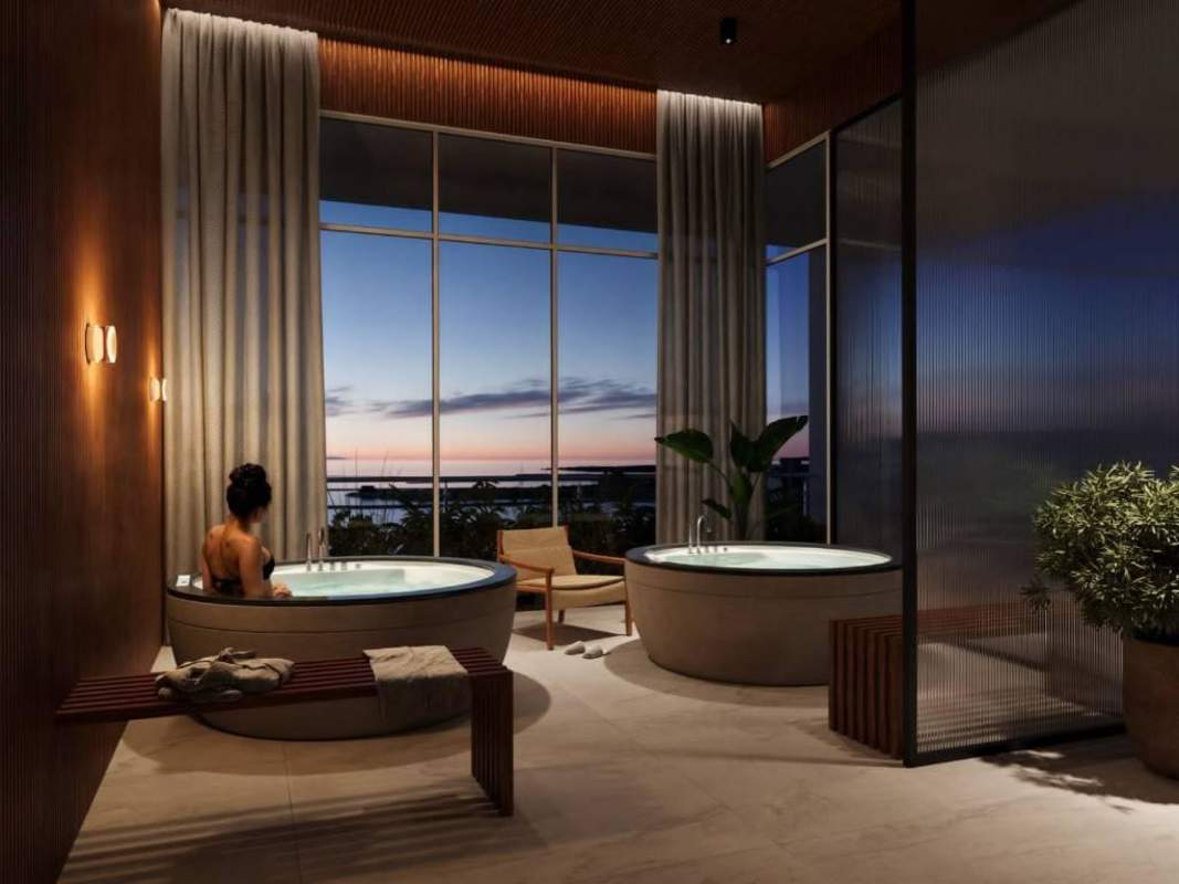 Rooftop infinity pool with fire pit, lounge areas and panoramic city water views at PH Torre Aqua Bella Vista Panama