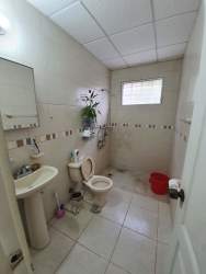 Covered patio overlooking backyard garden in Villa Las Palmeras Arraiján Panama