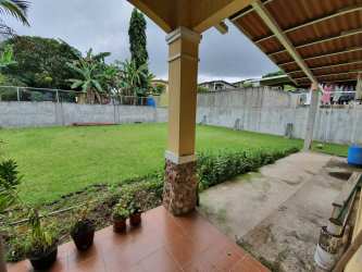 Simple bathroom with pedestal sink and shower tiled in Villa Las Palmeras Arraiján