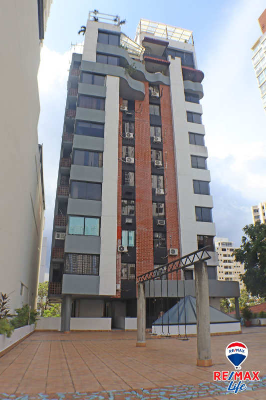 Kitchen featuring granite countertops dark cabinetry in PH Torre Altamira Panama