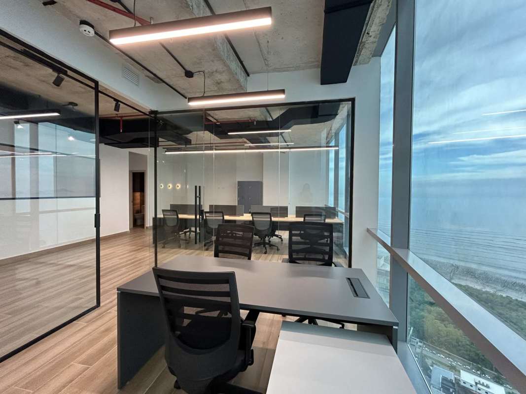 Minimalist private office with wood tile floor industrial ceiling Costa del Este Panama