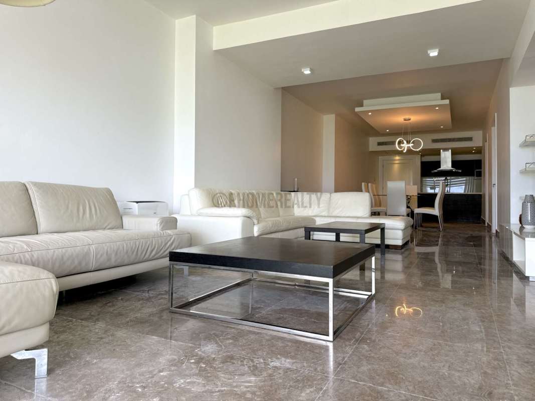 Large balcony with clear ocean and city views at Yoo Panama apartment