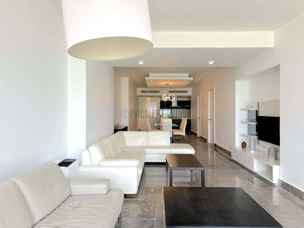 Bright master bedroom with balcony access, large windows and sea views in Yoo Panama Marbella Panama City