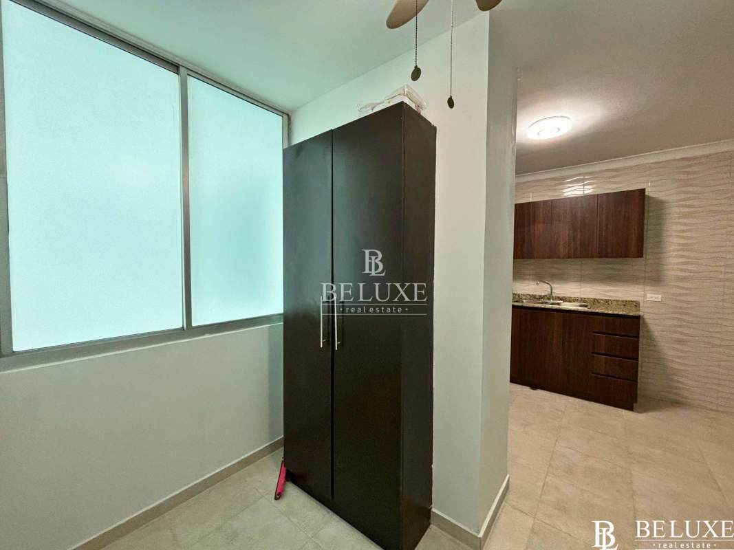 Modern bathroom with glass-enclosed shower and pedestal sink at PH Seawaves Obarrio Panama