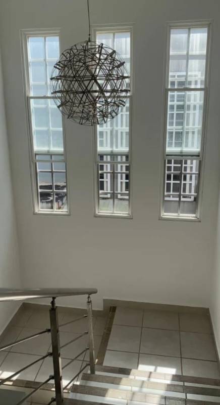 Bright bedroom with sliding glass door opening to balcony PH Victoria Brisas del Golf Panama