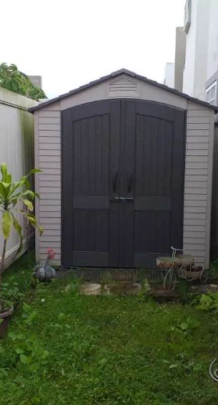 Main entrance porch with double glass doors and potted plants PH Victoria Brisas del Golf
