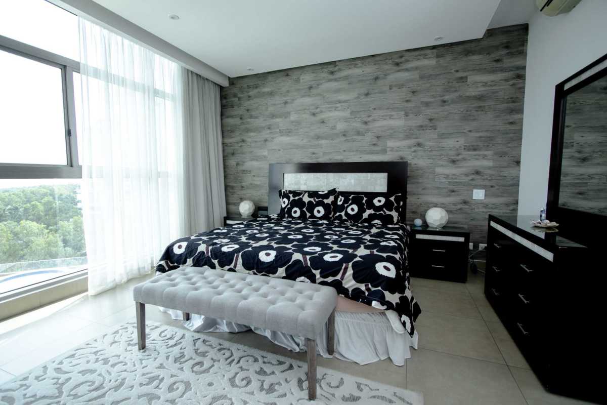 Modern gourmet kitchen in PH Paramount with island, granite countertops, stainless appliances