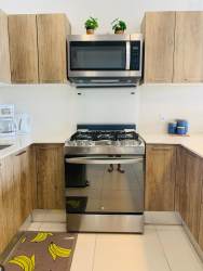 Bright secondary bedroom with large window at Solaria Punta Caelo beachfront apartment Panama